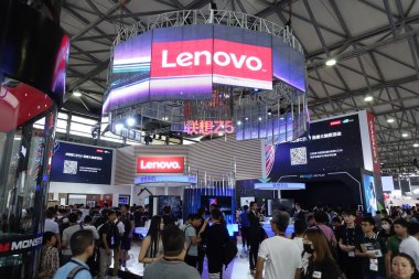 People visit the stand of Lenovo during an expo in Shanghai, China, 14 June 2018 clipart