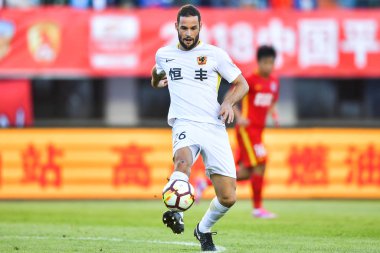 Spanish soccer player Mario Suarez of Guizhou Hengfeng dribbles against Changchun Yatai in their 22nd round match during the 2018 Chinese Football Association Super League (CSL) in Changchun city, northeast China's Jilin province, 15 September 2018