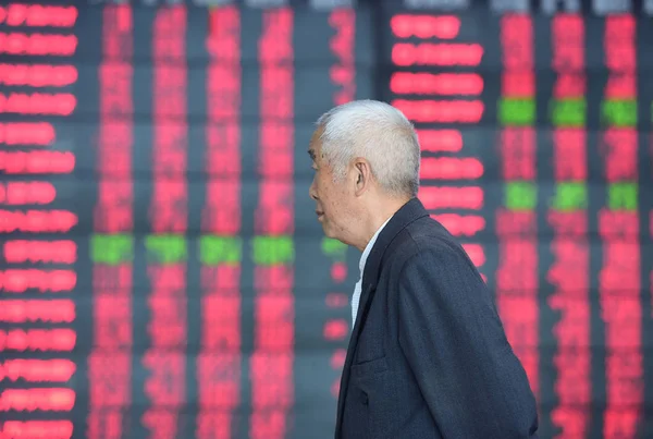 Chinese Investor Walks Screen Displaying Prices Shares Red Price Rising — 图库照片