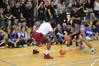NBA star LeBron James of Los Angeles Lakers shows his basketball skills during his China tour at the High School Affiliated to Shanghai Jiao Tong University in Shanghai, China, 26 August 2018. clipart
