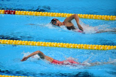 Wang Jianjiahe, upper, and Li Bingjie of China compete in the women's 1500m freestyle final during the 2018 Asian Games, officially known as the 18th Asian Games and also known as Jakarta Palembang 2018, in Jakarta, Indonesia, 18 August 2018 clipart