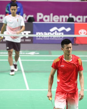 Chen Long of China reacts after being defeated by Anthony Ginting of Indonesia in the quarter-final badminton match of the men's singles during the 2018 Asian Games, officially known as the 18th Asian Games and also known as Jakarta Palembang 2018, i clipart