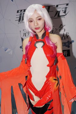 A showgirl dressed in cosplay costume poses during the 14th China International Cartoon & Game Expo (CCG Expo 2018) in Shanghai, China, 5 July 2018 clipart