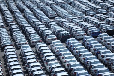 Vehicles to be shipped to abroad are lined up on the quay of a port in Dalian city, northeast China's Liaoning province, 12 August 2018 clipart