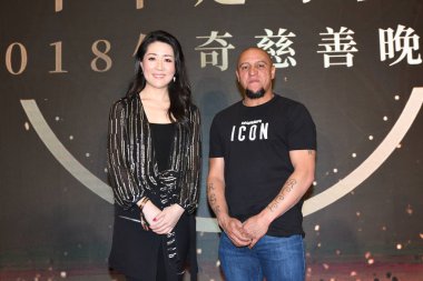 Former Brazilian football player Roberto Carlos, right, attends a charity event in Shanghai, China, 21 May 2018. clipart