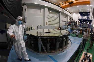 View of the silicon carbide (SiC) single reflector with a diameter of 4.03 meters, which is a vital component for creating a large-scale telescope, developed by the Changchun Institute of Optics, Fine Mechanics and Physics (CIOMP) of the Chinese Acad clipart