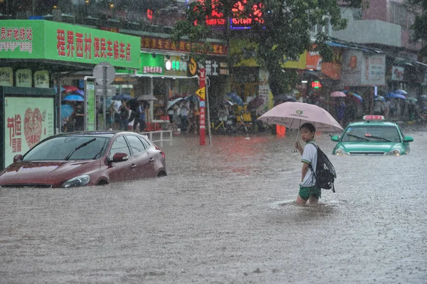 Student Shields Himself Umbrella Walks Flooded Road Heavy Rainstorm Caused — Stock Photo, Image