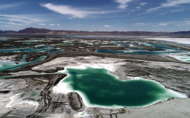 Aerial view of the Da Qaidam salt lake featuring the shape of emeralds in Haixi Mongol and Tibetan Autonomous Prefecture, northwest China's Qinghai province, 25 July 2018. clipart