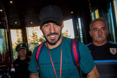 Uruguay and Barcelona football player Luis Suarez is pictured as he arrives at the hotel before the 2018 Gree China Cup International Football Championship in Nanning city, south China's Guangxi Zhuang Autonomous Region, 20 March 2018. clipart