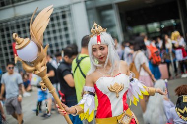 Chinese coser dressed in cosplay costume poses during the 6th Animation & Comics Beijing festival in Beijing, China, 22 July 2017 clipart