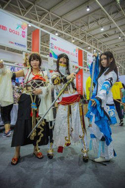 Chinese cosers dressed in cosplay costumes pose during the 6th Animation & Comics Beijing festival in Beijing, China, 22 July 2017 clipart