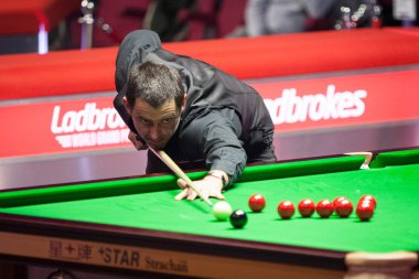 Ronnie O'Sullivan of England plays a shot to Yan Bingtao of China in their second round match during the 2018 Ladbrokes World Grand Prix snooker tournament in Preston, UK, 21 February 2018 clipart