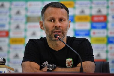 Head coach Ryan Giggs of Wales national football team attends a press conference before the semi-final match against China during the 2018 Gree China Cup International Football Championship in Nanning city, south China's Guangxi Zhuang Autonomous Reg clipart