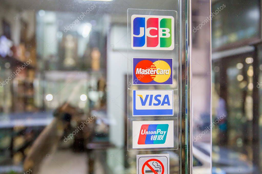 View of logos of JCB, MasterCard, Visa and China UnionPay (from upper) at a shop in Macau, China, 22 July 2017.