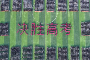 Young Chinese students take part in a mass rally to prepare for the upcoming annual college entrance examination, also known as Gaokao, at Hengshui No.2 High School in Hengshui city, north China's Hebei province, 26 February 2018 clipart