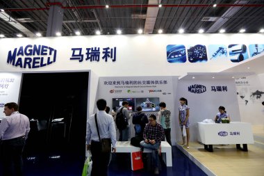 People visit the stand of Italian automotive supplier Magneti Marelli during the 16th Shanghai International Automobile Industry Exhibition, known as Auto Shanghai 2013, in Shanghai, China, 25 April 2015 clipart