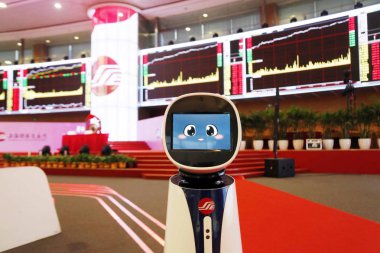 The artificial intelligent (AI) robot Zhen Zhen serves visitors at the Shanghai Stock Exchange Building in the Lujiazui Financial District in Pudong, Shanghai, China, 2 January 2018 clipart