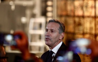 Howard Schultz, chairman of American coffee company and coffeehouse chain Starbucks, attends a press conference for the Starbucks Reserve Roastery in Shanghai, China, 5 December 2017. clipart