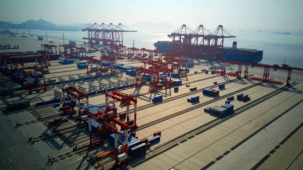 Aerial view of containers at the fourth phase of the Yangshan Deep-Water Port, the world's largest automated cargo wharf to start trial operation, in Shanghai, China, 6 December 2017 — Stock Image Aerial View Containers Fourth Phase Yangshan Deep Water Port World Stock Photo