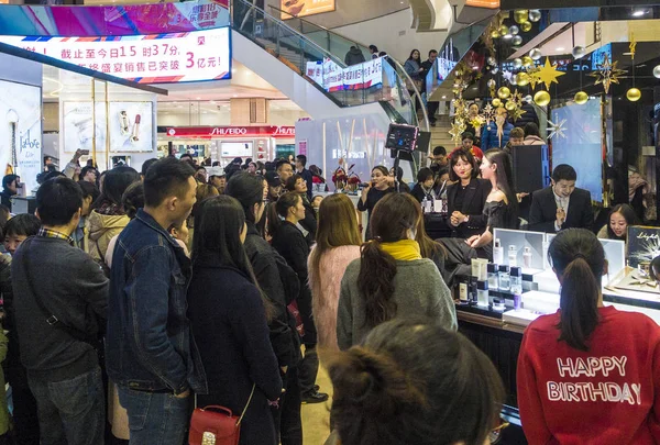 Chinese fans shop for peripheral products at a franchised store of
