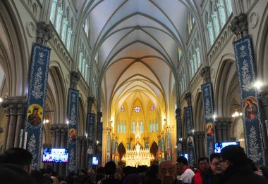 Chinese Catholic residents attend the reopening ceremony for the century-old Xujiahui cathedral after a two-year renovation in Xuhui district, Shanghai, China, 16 December 2017 clipart