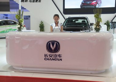 --FILE--An employee is pictured at the stand of Changan Auto during an exhibition in Beijing, China, 20 October 2014.  clipart