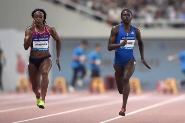 Elaine Thompson of Jamaica, left, competes in the women's 100m during the IAAF Diamond League Shanghai 2017 in Shanghai, China, 13 May 2017 clipart