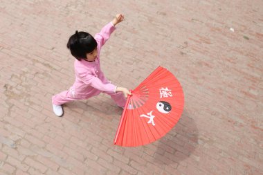 A Chinese enthusiast practises Tai chi in Chenjiagou Village, Wenxian county, Jiaozuo city, central China's Henan province, 26 April 2017 clipart