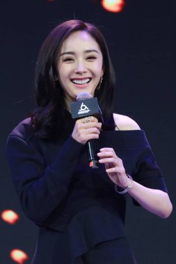 Chinese actress Yang Mi attends a press conference to promote variety show 'The coming one' in Beijing, China, 10 March 2017. clipart