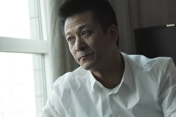 Quanjian グループの創設者兼会長であるシュウ Yuhui 中国の天津でのインタビューに描かれ 2014 月8日 — ストック写真