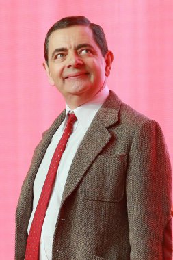 English actor Rowan Atkinson plays Mr. Bean during a premiere for his movie 