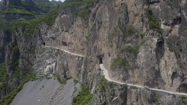 stock image Aerial view of the road carved by local villagers on the edge of a cliff on Taihang Mountains in Hongtiguan village, Pingshun county, Changzhi city, north China's Shanxi province, 7 May 2017