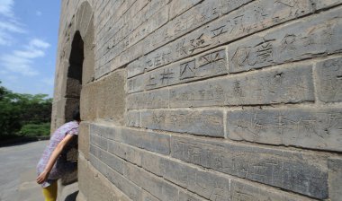 View of graffiti left by unruly tourists in the 1980s and 1990s on a pagoda in Twin Pagodas Temple in Taiyuan city, north China's Shanxi province, 18 May 2017 clipart