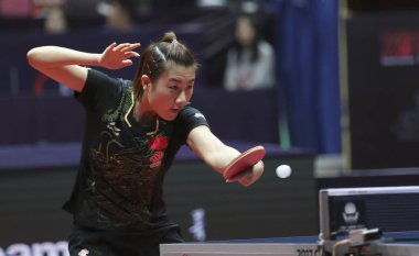 Ding Ning of China returns a shot to Miu Hirano of Japan in their women's singles Quarterfinals match during the Seamaster 2017 ITTF World Tour Platinum China Open in Chengdu city, southwest China's Sichuan province, 24 June 2017 clipart