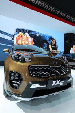A KX5 of Dongfeng Yueda Kia Motor is on display during an automobile exhibition in Haikou city, south China's Hainan province, 10 September 2016