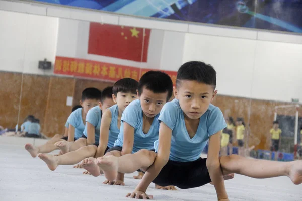 Young Chinese Boys Bend Bodies Keep Balance Hands Floor Practice — 스톡 사진