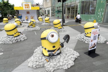 Hundreds of Minions-shaped sculptures armed with spades to promote American 3D computer-animated comedy film ''Despicable Me 3'' which will be released on July 7 are pictured in Joy City at Xizang Road in Shanghai, China, 15 June 2017 clipart