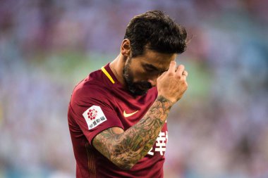 Argentine football player Ezequiel Lavezzi of Hebei China Fortune celebreates after scoring a goal against Guizhou Hengfeng Zhicheng in their 18th round match during the 2017 Chinese Football Association Super League (CSL) in Guiyang city, southwest  clipart