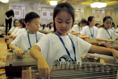 An ensemble of 2500 Guzheng performers perform to create a Guinness World Records in Macau, 21 August 2017 clipart