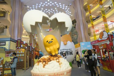 Popular Japanese cartoon character Gudetama, or lazy egg, created by Hello Kitty's developer Sanrio, makes its debut in Shanghai, China, 19 June 2017 clipart