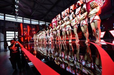 Showgirls pose on the stage during the 15th China Digital Entertainment Expo, also known as China Joy 2017, Shanghai, China, 27 July 2017. clipart