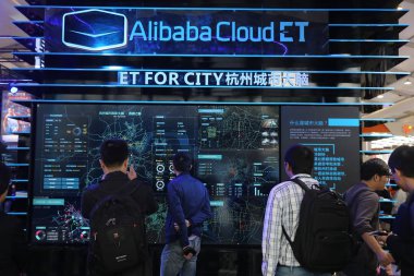 People visit the stand of Alibaba Cloud ET for City during an exhibition in Shanghai, China, 14 October 2016 clipart