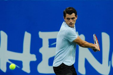 Taylor Fritz of America returns a shot to Guido Pella of Argentina in their quarterfinal match of the men's singles during the 2017 Chengdu Open tennis tournament at Sichuan International Tennis Center in Chengdu city, southwest China's Sichuan provi clipart