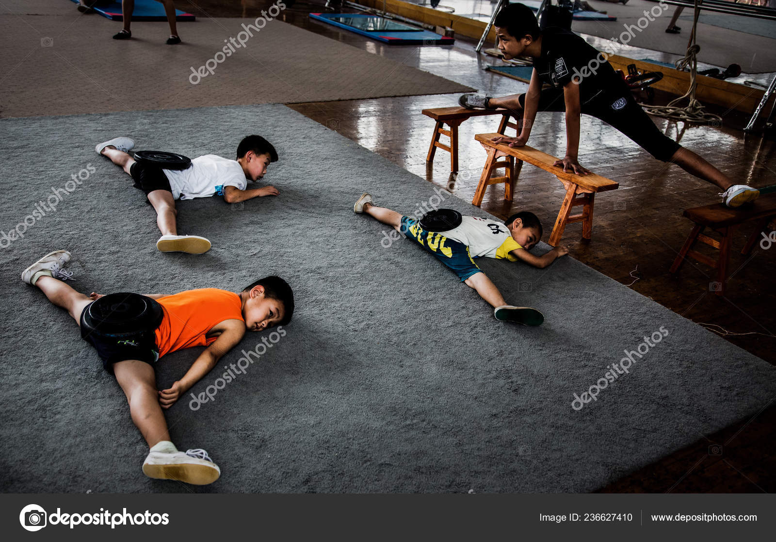 Chinese Children Bend Bodies Weight Plates Floor Practice