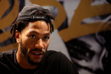NBA star Derrick Rose of Cleveland Cavaliers is interviewed during a promotional event in Shenyang city, northeast China's Liaoning province, 2 September 2017. clipart