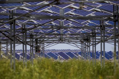 Solar panels are installed at a photovoltaic (PV) power plant of Elion Resources Group in Kubuqi Desert in Ordos city, north China's Inner Mongolia Autonomous Region, 28 July 2017 clipart