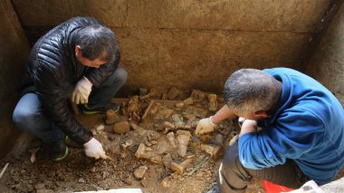 Chinese archaeologists unearth relics from the tomb of Yang Jiazhen, who is the 18th generation chieftain (Tusi) in Bozhou, in Bozhou district, in Zunyi city, southwest China's Guizhou province, 19 February 2017 clipart