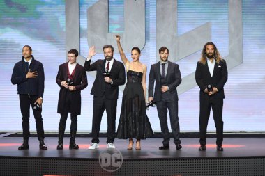 (From left) American stage actor Ray Fisher, actor and singer Ezra Miller, actor and director Ben Affleck, Israeli actress and model Gal Gadot, British actor Henry Cavill, and American actor and model Jason Momoa attend a press conference for the mov clipart