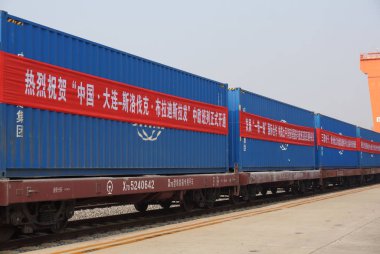 A freight train heading for Bratislava of Slovakia is pictured during the launching ceremony of China Dalian C Slovakia Bratislava Block Train before departing from a cargo railway station in Shenyang city, northeast China's Liaoning province, 27 Oc  clipart