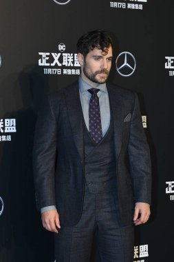 British actor Henry Cavill poses as he arrives on the red carpet for the movie 